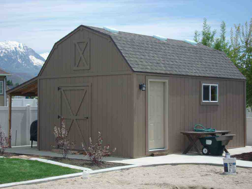 Farm-style shed with barn door and man door, perfect for backyard storage or workspace use