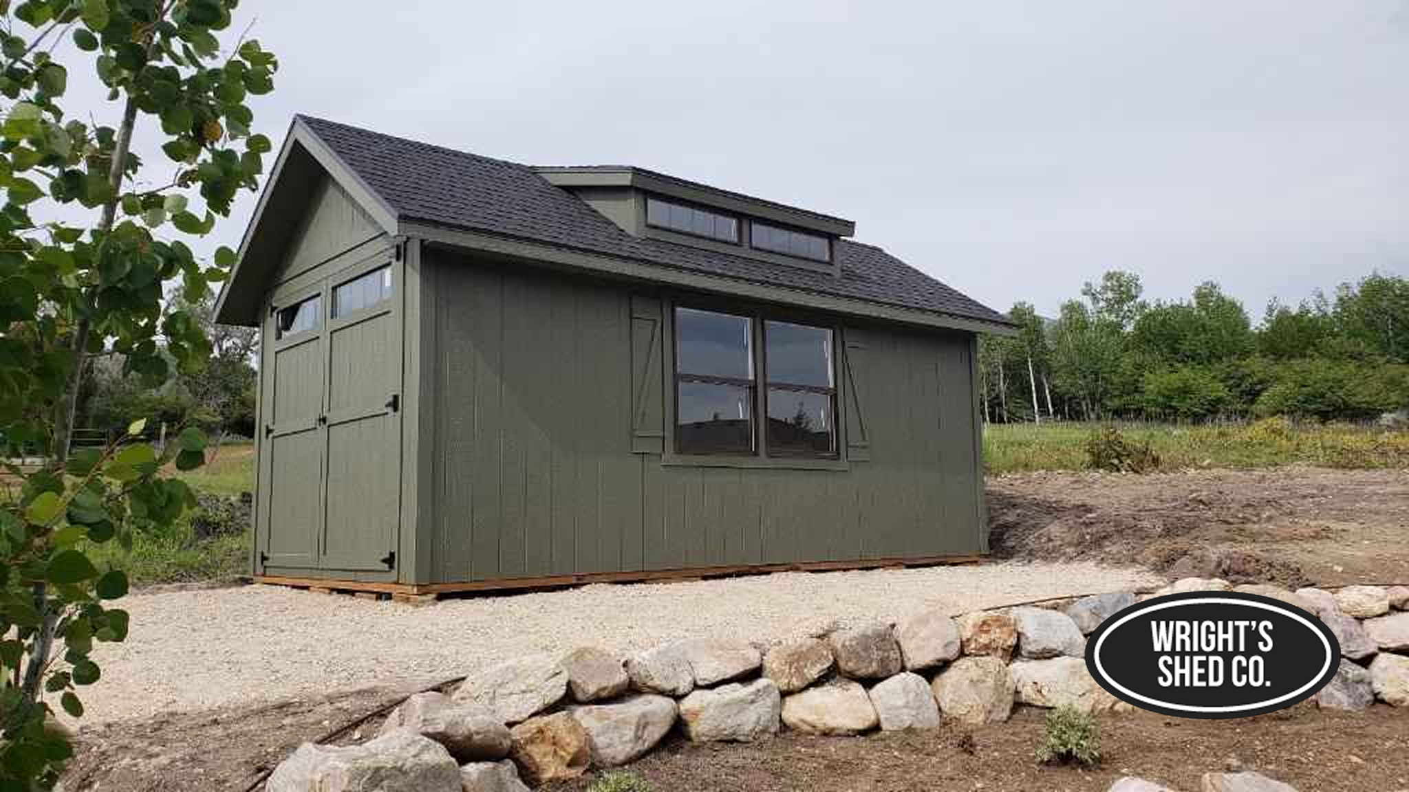 Rustic Workshop Shed With Windows and Overhang Green workshop shed with windows, loft-style roof, and extended overhang, designed for workspace, storage, and outdoor durability.