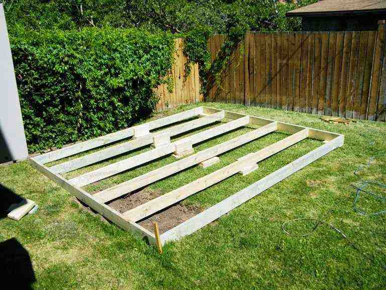 Wooden foundation frame for a backyard shed using DIY shed kits Utah—step one of a custom build