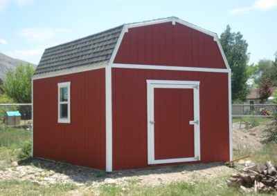 red and white farm style shed