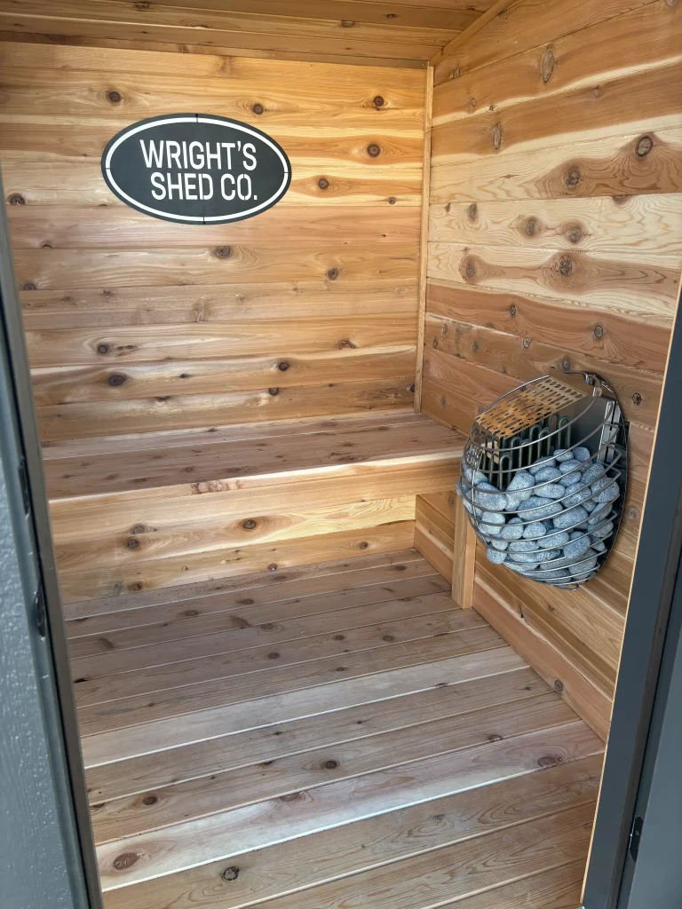 What size sauna do I need? This cedar sauna interior features a spacious bench, wood walls, and sauna heater.