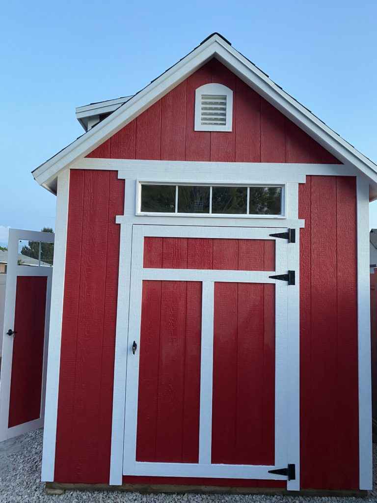 white door trim on red shed
