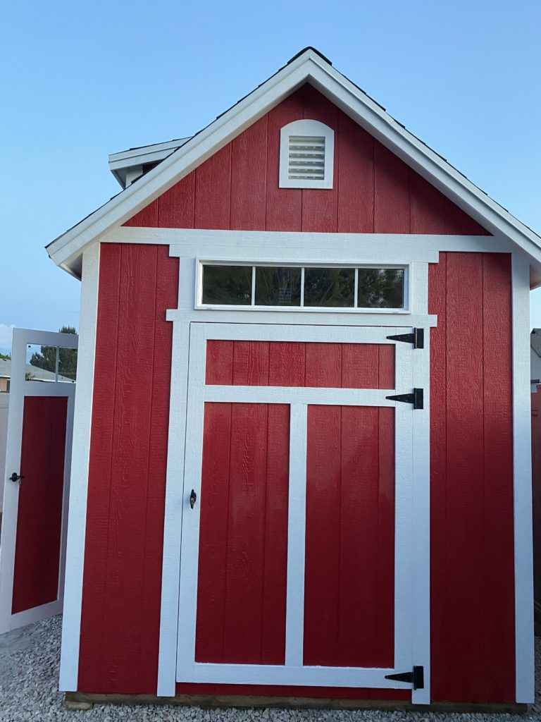 white door trim on red shed