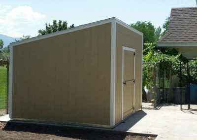 unpainted lean-to shed