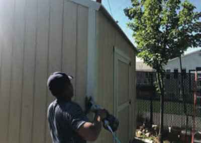 man working on shed