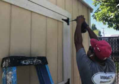 Man building shed's door