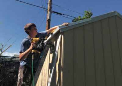 a person working on a shed