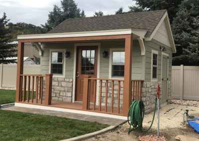 She Shed with Porch and Railings